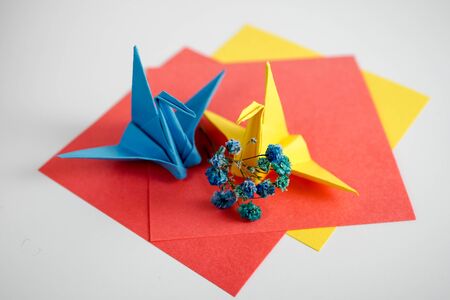 Photo of a cute crane made of paper. Beautiful origami. Close-up.の写真素材
