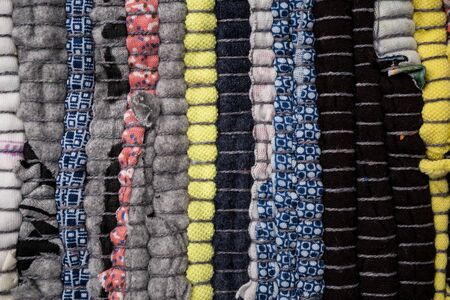 Texture of a multi-colored rug made from different fabricsの写真素材