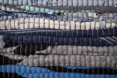 Texture of a multi-colored rug made from different fabricsの写真素材