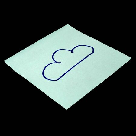 Paper sticker with the image of the cloud symbol. Isolated object on a black background. Paper texture. Sticky note. A piece of paper for notes. Self-adhesive piece of paper.の写真素材