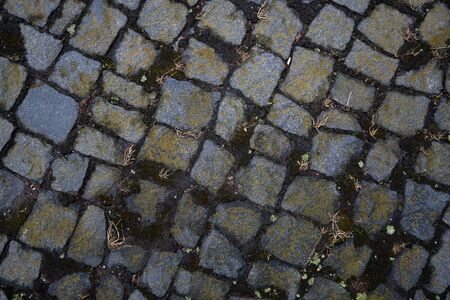 Graphic resources background image of sidewalk texture. Sett are a hard pavement, a kind of roadway. Coarsely chopped to approximately rectangular shape and laid out in regular rows.の写真素材
