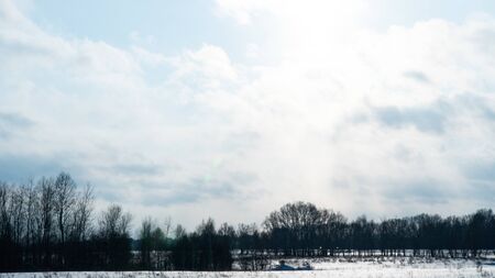 Beautiful winter landscape. Snow covered area. Cold weather. Winter season. Beautiful sky with clouds. Endless snow plains. Russia, Siberia, Altai Territory, Belokurikha.の写真素材