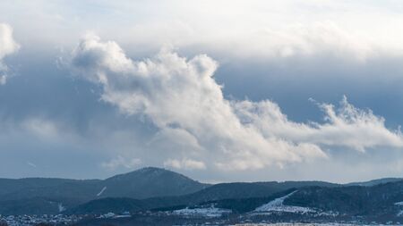 Beautiful winter landscape. Snow covered area. Cold weather. Winter season. Beautiful sky with clouds. Endless snow plains. Russia, Siberia, Altai Territory, Belokurikha.の写真素材