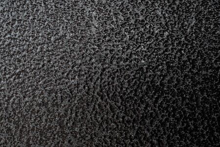 Detailed metal coating texture. Corrosion-resistant coating. Abstract background. A closeup. Dark colors. Background image. Space for text. Desktop wallpaper. Top view.の写真素材