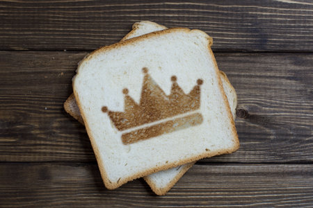 toast with the crown sign on dark wood. Royal toast.の写真素材
