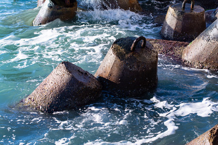 breakwater close-up. Protecting the coastline from destruction. Concrete structures.