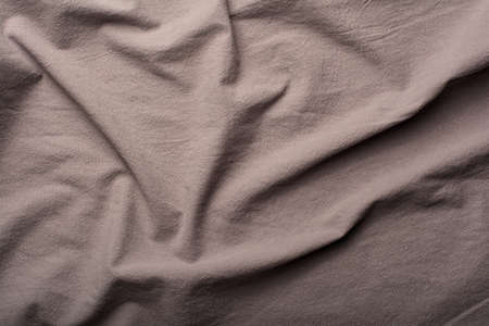 Detailed image of crumpled fabric. Image for the background. soft shadows. Close-up shot of fabric texture.の写真素材