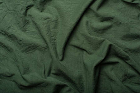 Detailed image of crumpled fabric. Image for the background. soft shadows. Close-up shot of fabric texture.の写真素材
