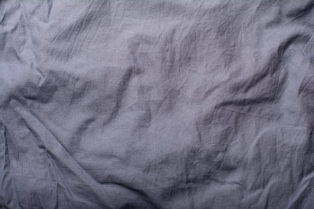 Detailed image of crumpled fabric. Image for the background. soft shadows. Close-up shot of fabric texture.の写真素材