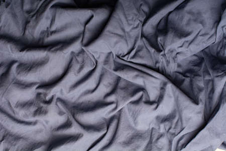 Detailed image of crumpled fabric. Image for the background. soft shadows. Close-up shot of fabric...
