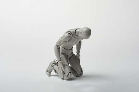 Male figure on his knees. Asking for forgiveness. A plea for something. Sorrowful bow.の写真素材