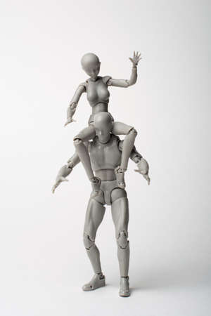The female figurine sits on the male. Ride a man. Lovers fooling around. Try to hold onto me. Young...