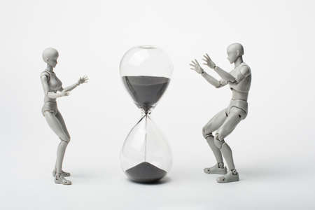 An attempt to stop time. Time spares none. Regret for the past. Time is running away like sand. The grief of lost time. Missed opportunities. The past cannot be returned.の写真素材