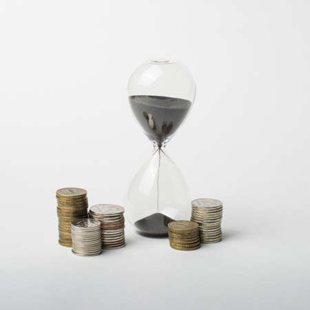 Time is money. Money flows like sand. time to save.の写真素材