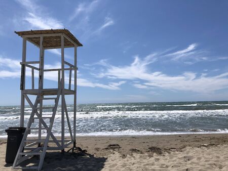 A white lifeguard tower on the beach .の写真素材