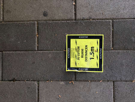 Keep the distance sign on the ground.の写真素材