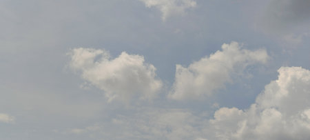Clouds in the blue sky during the day as a background.