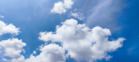 Blue sky background with tiny clouds. Panoramic image of blue sky.