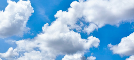 White fluffy clouds in the blue sky. Panoramic image.の写真素材