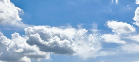 Blue sky with white clouds background. Panoramic image of blue sky.