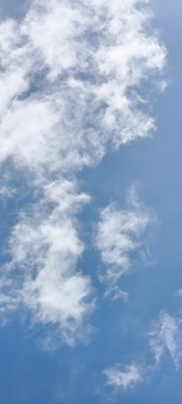 Clouds in the blue skybe used as background.の写真素材