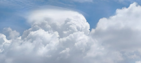 Blue sky background with white clouds. Cumulus white clouds in the blue sky.の写真素材