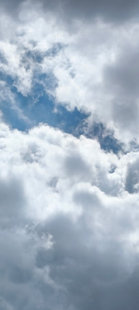The vast blue sky and clouds create a beautiful background.