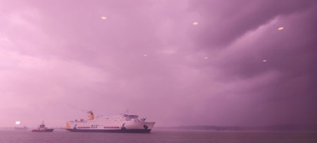 Panoramic view of a cruise ship in the sea at sunsetのeditorial素材