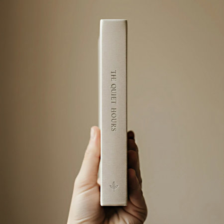 A hand holding a book with the word E-learning written on it.の素材