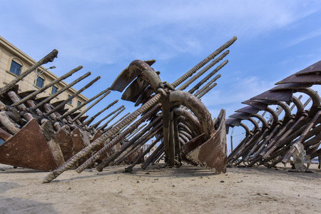 Iron anchors in a fishing portのeditorial素材