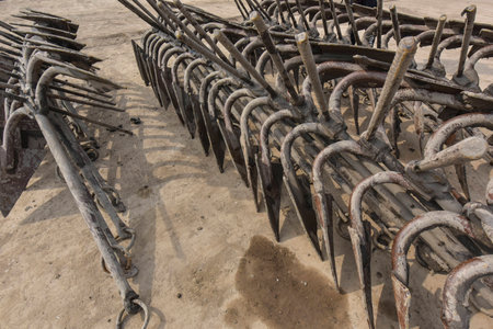 Iron anchors in a fishing port
