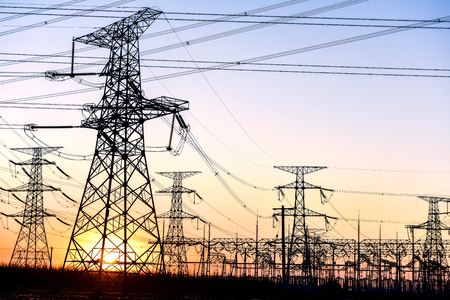 The Contour of Transmission Tower in the Background of Sunsetの写真素材