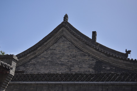 Ancient Chinese Architectural Gateway Wall under Clear Sky and White Cloud, Pingyao County, Jinzhong...