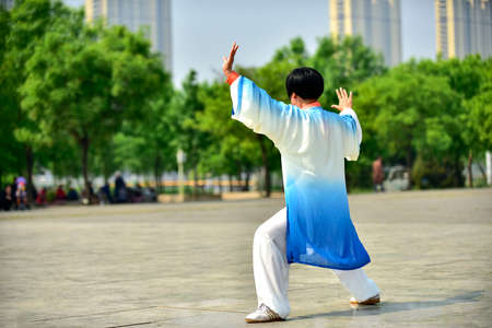 Tangshan, hebei province, China -- May 11, 2019: a Chinese woman performs tai chi at a squareのeditorial素材