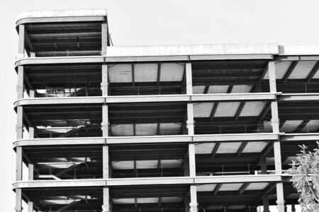 Close-up of steel frame under construction under blue sky background, black and white effectの写真素材