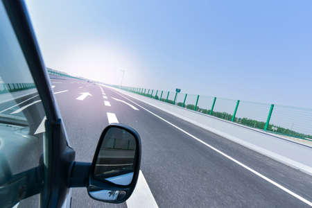 A view of the highway taken from a moving car
