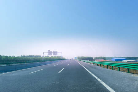 A view of the highway taken from a moving carの写真素材