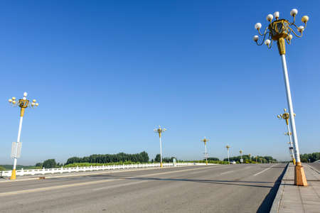 Asphalt roads and Bridges, sidewalks, and skylines against a backdrop of blue sky