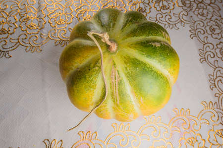 Fruit oranges placed on the tablecloth and platesの写真素材