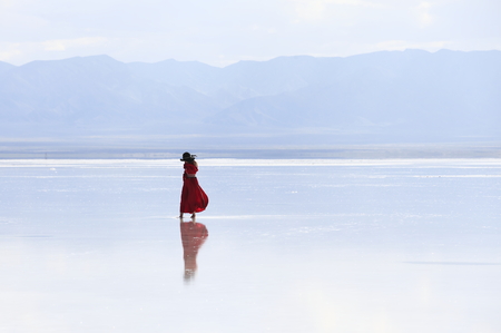 a woman on salt lakeの写真素材