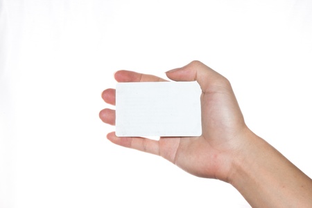 Hand holding an empty business card on white backgroundの写真素材