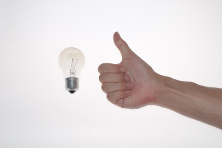 a gesture with lamp bulbの写真素材