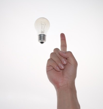 a gesture with lamp bulbの写真素材