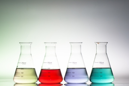 glass laboratory apparatus with color waterの写真素材