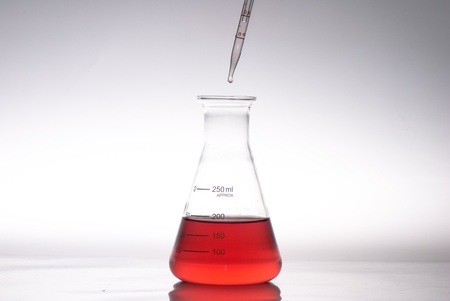 glass laboratory apparatus with color waterの写真素材