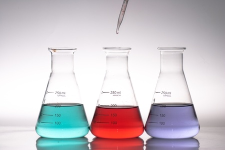 glass laboratory apparatus with color waterの写真素材