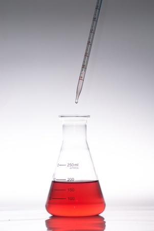 glass laboratory apparatus with color waterの写真素材