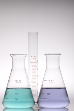 glass laboratory apparatus with color waterの写真素材