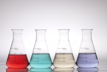 glass laboratory apparatus with color waterの写真素材