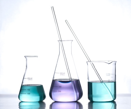 glass laboratory apparatus with color waterの写真素材